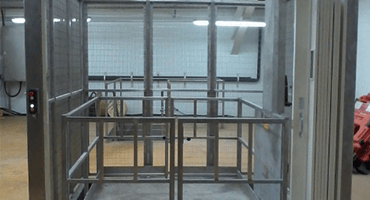 triple action goods lift in warehouse 