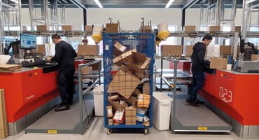 Workers in warehouse working on translyft work platforms