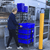 Supermarket employee removing trolley from lifting table